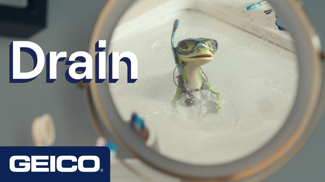 The GEICO Gecko in a sink wearing a snorkel, with the original Drain title and GEICO mark.