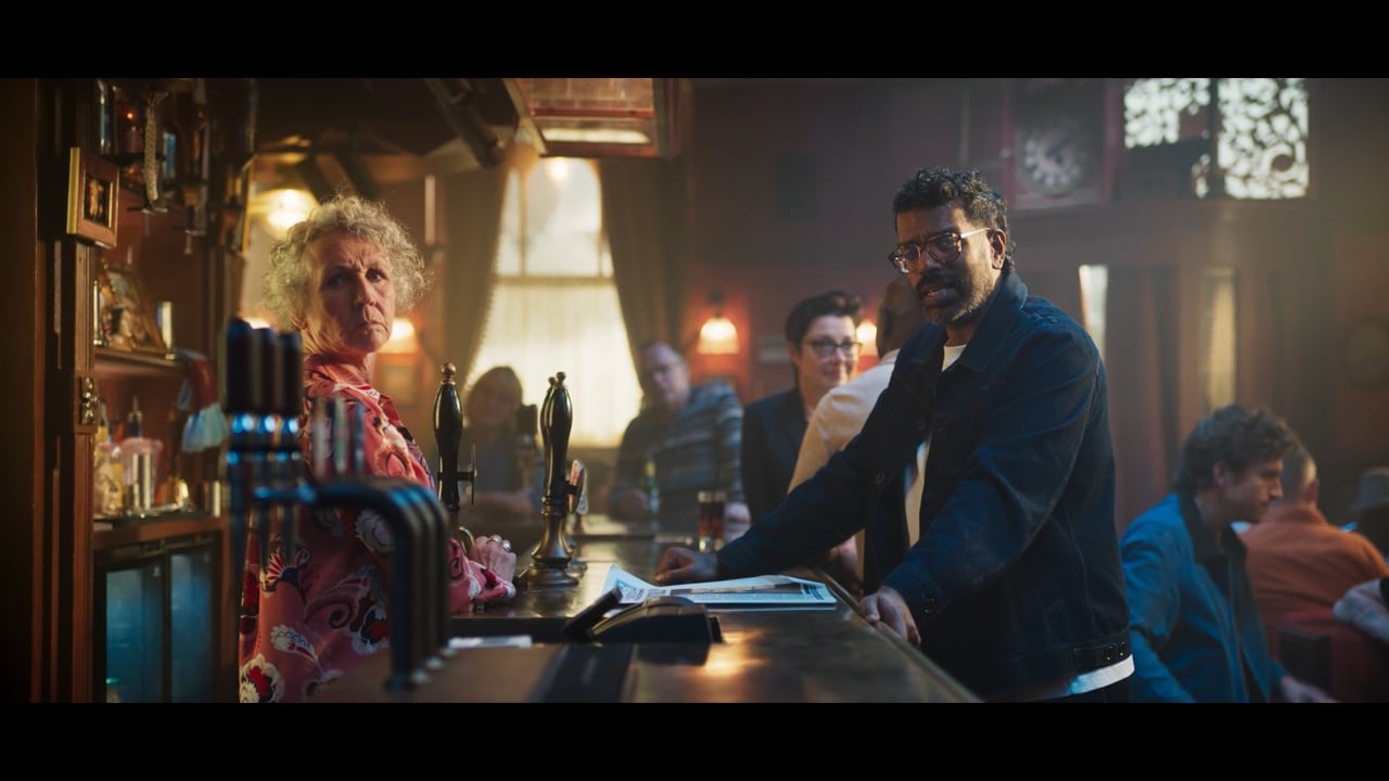 Two people at a pub bar in a scene from This is our BBC.