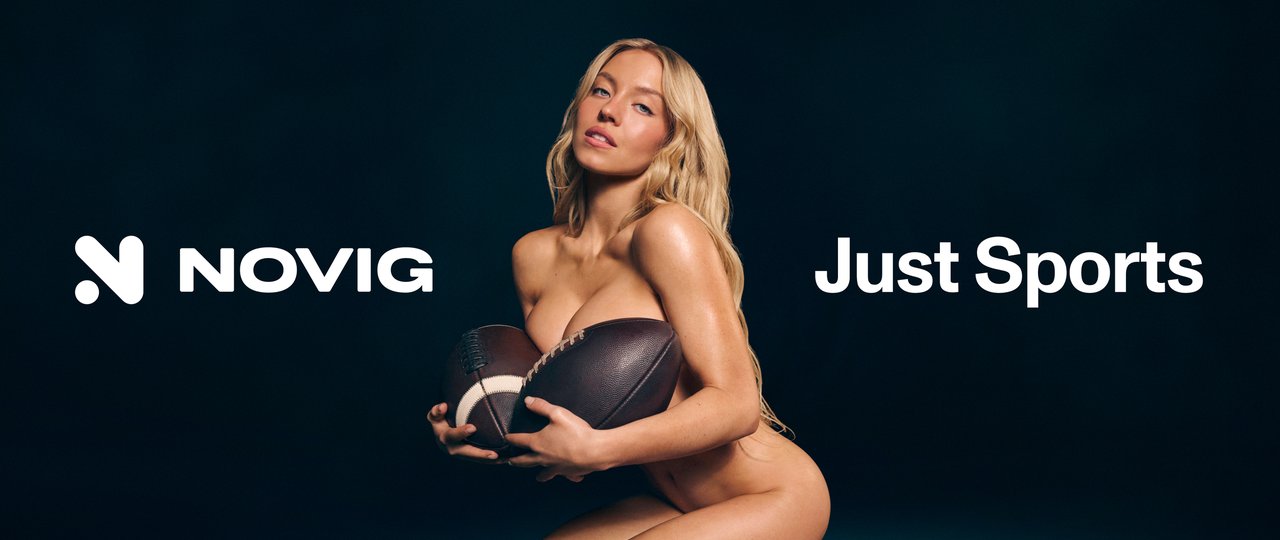 Sydney Sweeney holding two American footballs between the Novig logo and the words Just Sports.